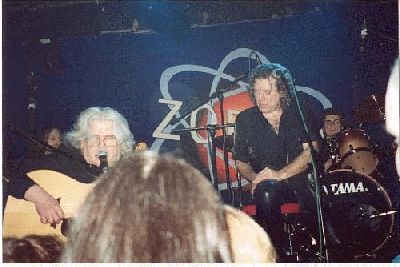 Photo: Tim in performance, with Robert Plant